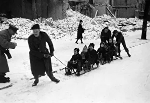 Berlin Prints: Snow in Berlin. Children going to school on sleighs being pulled by British