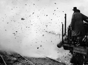 Snow and ice are blown from the railway lines as the turbo jet engines were used in tests