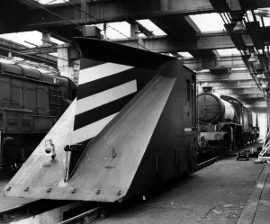 Sheds Prints: A snowplough waiting to be attached to an engine in the sheds on 9th September 1972