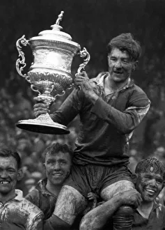 Soaked to the skin, caked in mud but very happy are these Warrington lads as they cheir