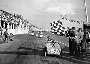 00484 Prints: Soapbox winner rattles past. On every conceivable contraption that can be pedalled
