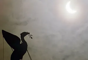 01106 Prints: The solar eclipse pictured behind the Silhouette of the Liver Bird on a tower of