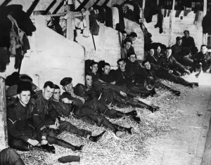 Tired Prints: Solders of the British Expeditionary Force billeted in a French barn as they get some