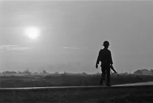 Asia Prints: A soldier of the South Vietnamese army advances on Viet Cong positions in Trang Bang just