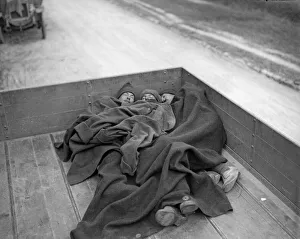 00117 Prints: Soldiers of the Army Service Corp asleep in the rear of a lorry following a hard days
