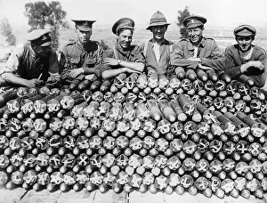 Ammunition Prints: Soldiers from Britain and the Empire leaning of a large pile of 18 pounder shells during