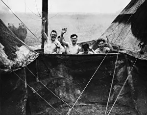 Soldiers of the British Expeditionary Force in Northern France give a wave to camera as