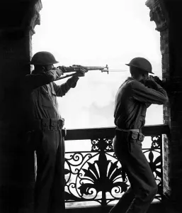 Asia Prints: Soldiers of the Chinese defence force in Shanghai uniform with rifles take aim as they
