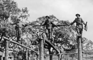 01433 Prints: Soldiers crossing a log bridge during an inter-team competition held on an East Riding