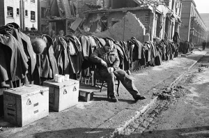 Soldiers discarded tunics and coats as they help with the clean up of Chelsea following