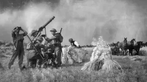 Firing Prints: Soldiers with a Lewis Gun defend a farmer and his crops in Kent during the harvest