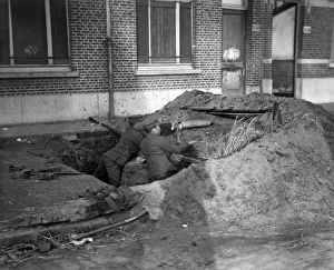 Two soldiers of the Naval brigade seen here in a trench on the Lierre Road manning a