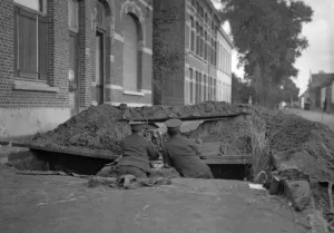 Two soldiers of the Naval brigade seen here in a trench on the Lierre Road manning a
