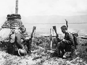 00407 Prints: Two soldiers pay tribute by the grave of a fallen comrade on leaving the front line