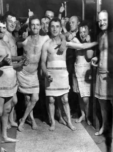 Soldiers from the Royal Pioneer Corps men enjoy a bath after labouring on air raid