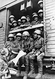 Russia Prints: Soldiers of the Soviet Red Army reading newspapers to catch up on the latest news