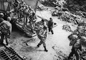 01459 Prints: These soldiers stride off their landing craft onto the rocky shores of Kiska Island