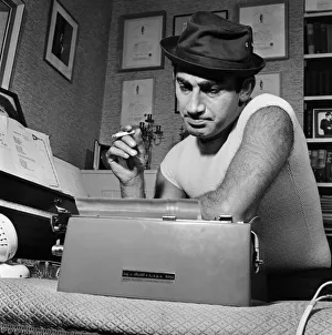 Songwriter and composer Lionel Bart in his flat in South Kensington