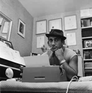 Songwriter and composer Lionel Bart in his flat in South Kensington