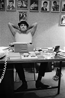 Songwriter and composer Lionel Bart in his flat in South Kensington