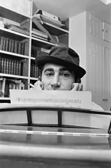 Songwriter and composer Lionel Bart in his flat in South Kensington
