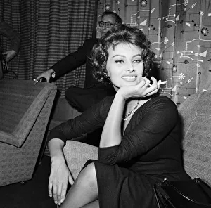 Sophia Loren pictured sitting in a chair at London Airport