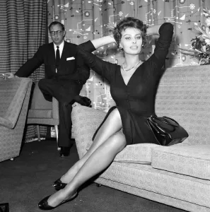 Sophia Loren pictured sitting in a chair at London Airport
