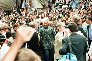 00289 Prints: South African President Nelson Mandela seen here visiting Brixton Market with Prince
