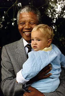 South Africa Prints: South Africas President Nelson Mandela with a young white boy