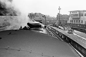 1938 Prints: Southern Railways King Arthur Class locomotive departing Waterloo station. November 1938