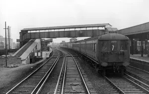 Electric Prints: A Southern Railways main line electric train passing through Raynes Park. c