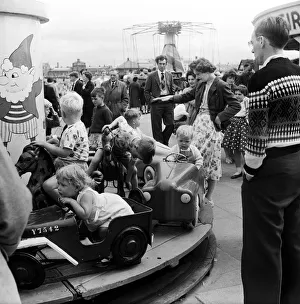 Fairground Prints: Southport, Merseyside, the childrens fairground is always crowded with youngsters