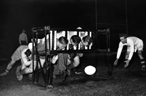 Fitness Prints: Southport Rugby League team practice with scrum machine. 6th February 1951