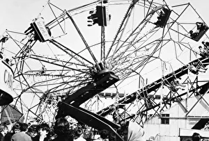 00065 Prints: The Spanish City amusement park in Whitley Bay - holidaymakers enjoy a spin on one of