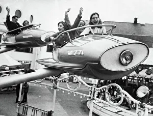 The Spanish City amusement park in Whitley Bay - youngsters flying high on one of