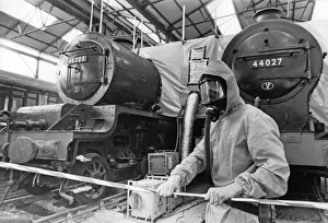 Face Mask Prints: Specialist removing blue asbestos from two vintage steam train - Midland Railway Trust