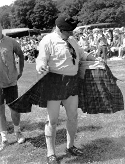 Kilts Prints: Spectators at Luss Highland Gathering cheered as 71-year-old games president Bob Kerr