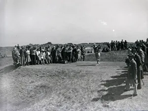 Spectatotrs watch a competitor tee off during the 1949 British Open at Royal St