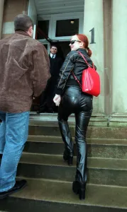 Spice Girls Geri Halliwell wearing black leather trousers sunglasses red bag April 1998