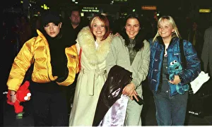 00085 Prints: The Spice Girls at Heathrow Airport January 1998 Victoria Adams Geri Halliwell Mel