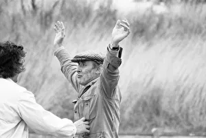 Arms Raised Prints: Spike Milligan on location filming the Nuns Olympics for his new tv series