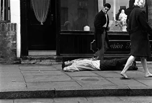 Spike Milligan March 1963 comedian prostrate outside an Islington undertakers