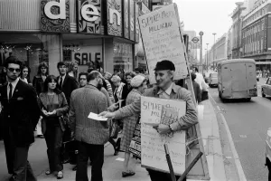 Spike Milligan & wife Paddy use a Sandwich board - borrowed from British Rail Lost