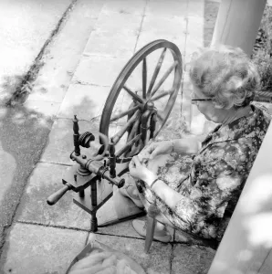 The SpinnersI guild of Kent. Women using hand operated loom