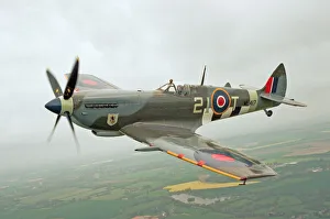 Anglia Prints: A Spitfire Mk IXe (ML417) of the Fighter Collection seen here in the skies above Duxford