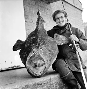 Sport: Fishing: Turkey farmer Tim Clark (22) pictured with the 58lb 50z Angler fish that