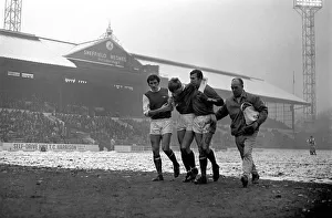 Sport: Football: Sheffield Wednesday v. Arsenal. Whitham helped by Arsenal players