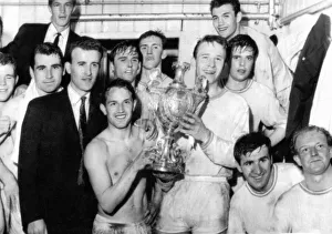 00606 Prints: Sport - Football - Swansea Town players hold aloft the Welsh Cup in their dressing room