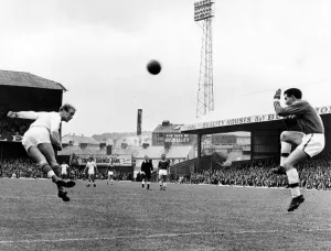 00607 Prints: Sport - Football - Swansea Town - Swansea winger Barrie Jones heads towards