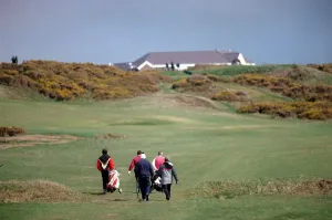 Trolley Prints: Sport - Golf - Royal Porthcawl - A general shot of golfers playing the course at Royal